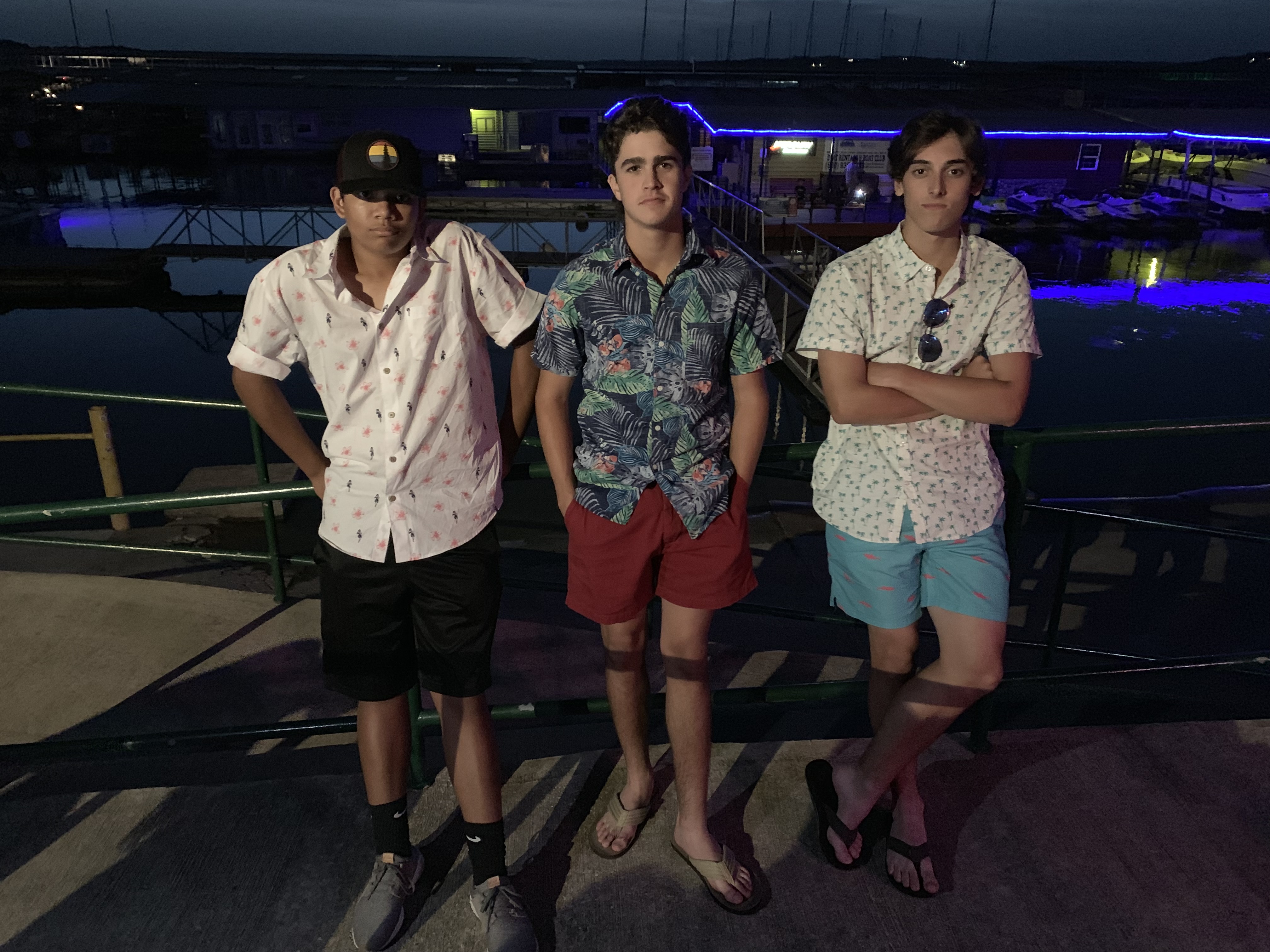 Noah Johnson, Jack Brown and Chris Skladal posed for a photograph in front of docks